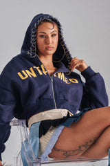 UNTAMED METAL RING SWEATSHIRT